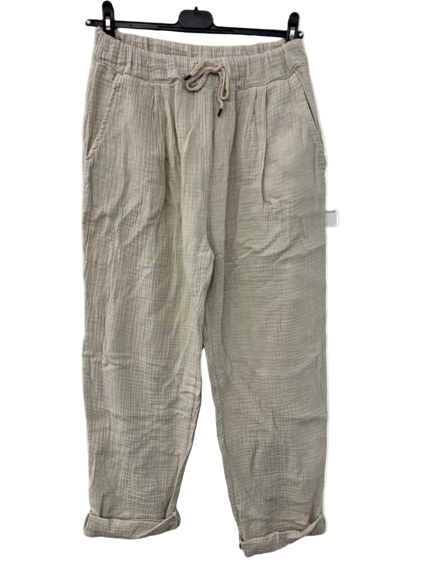 Beige cotton gauze trousers with a drawstring on a white background