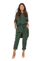 Woman wearing a green outfit on a white background
