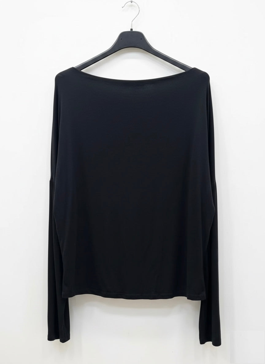 Black long-sleeve top on a hanger against a white background