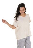 Woman wearing a white sweater