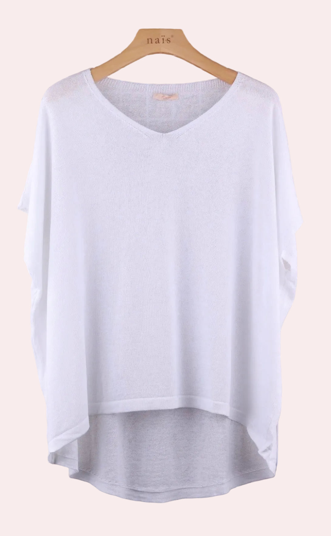 White sweater n a hanger 