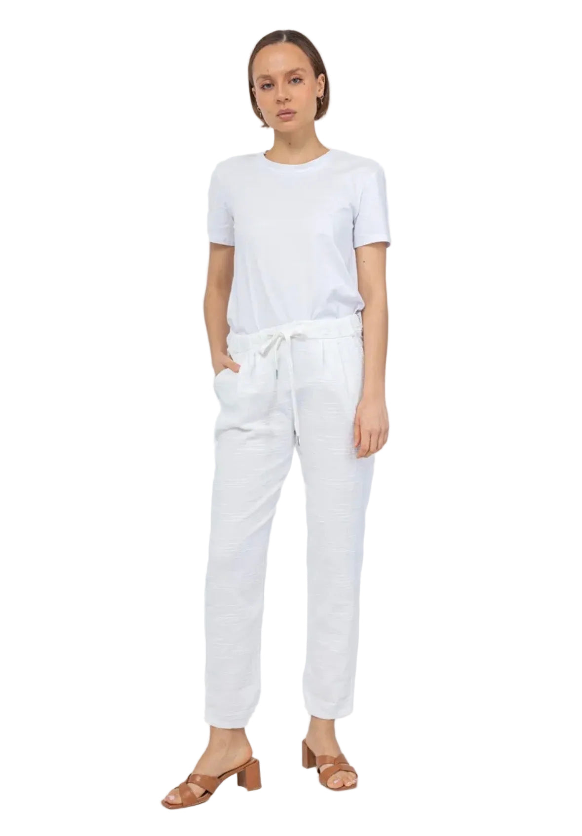 Woman wearing a white t-shirt and pants on a white background