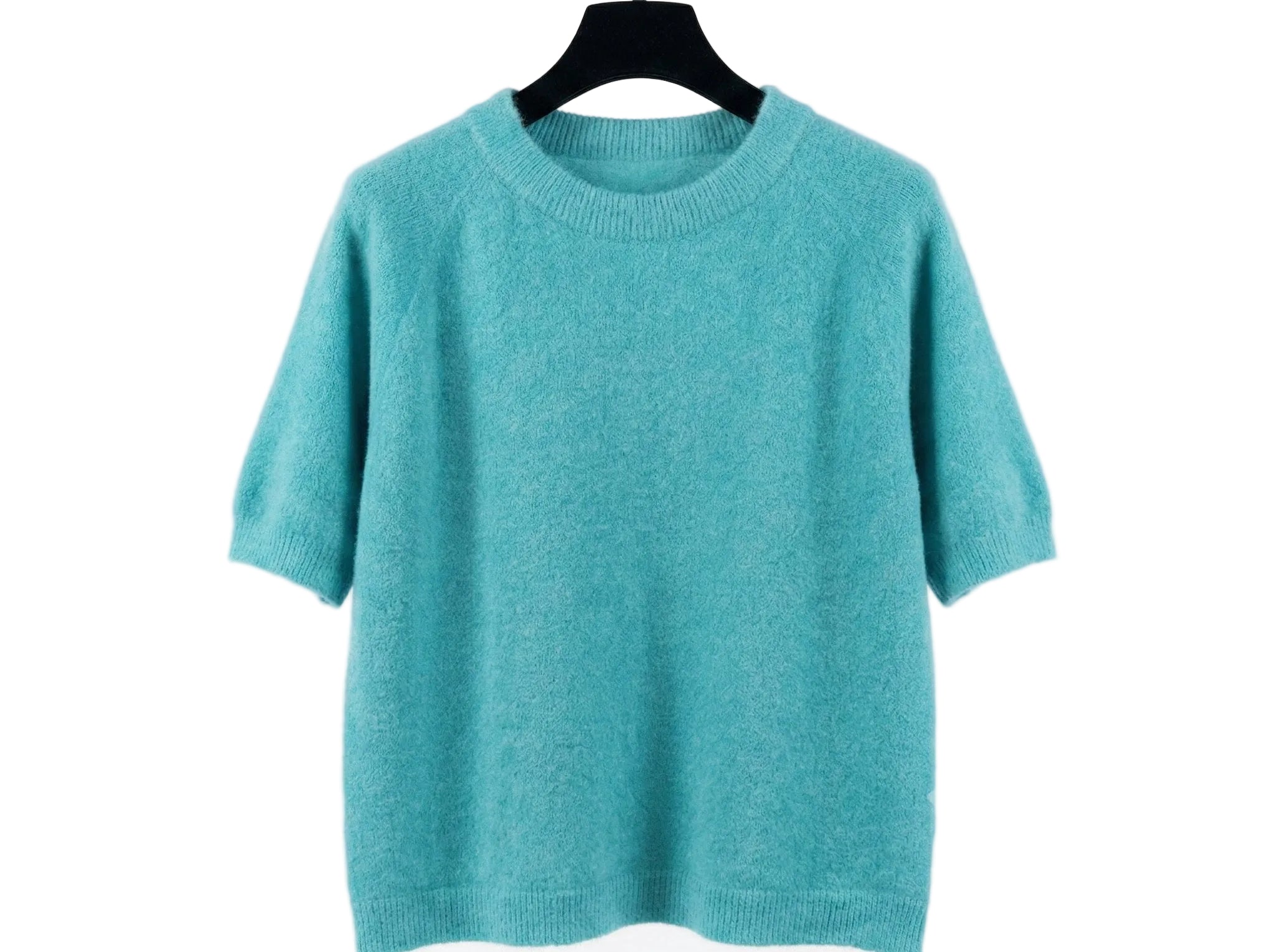 Teal sweater on a hanger against a white background