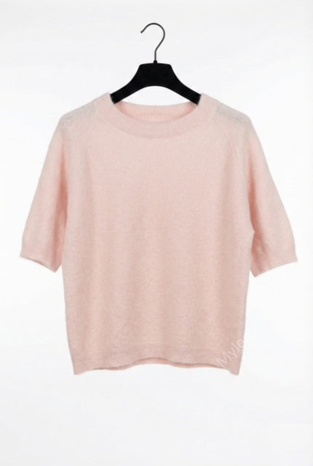 Pink t-shirt on a black hanger against a white background