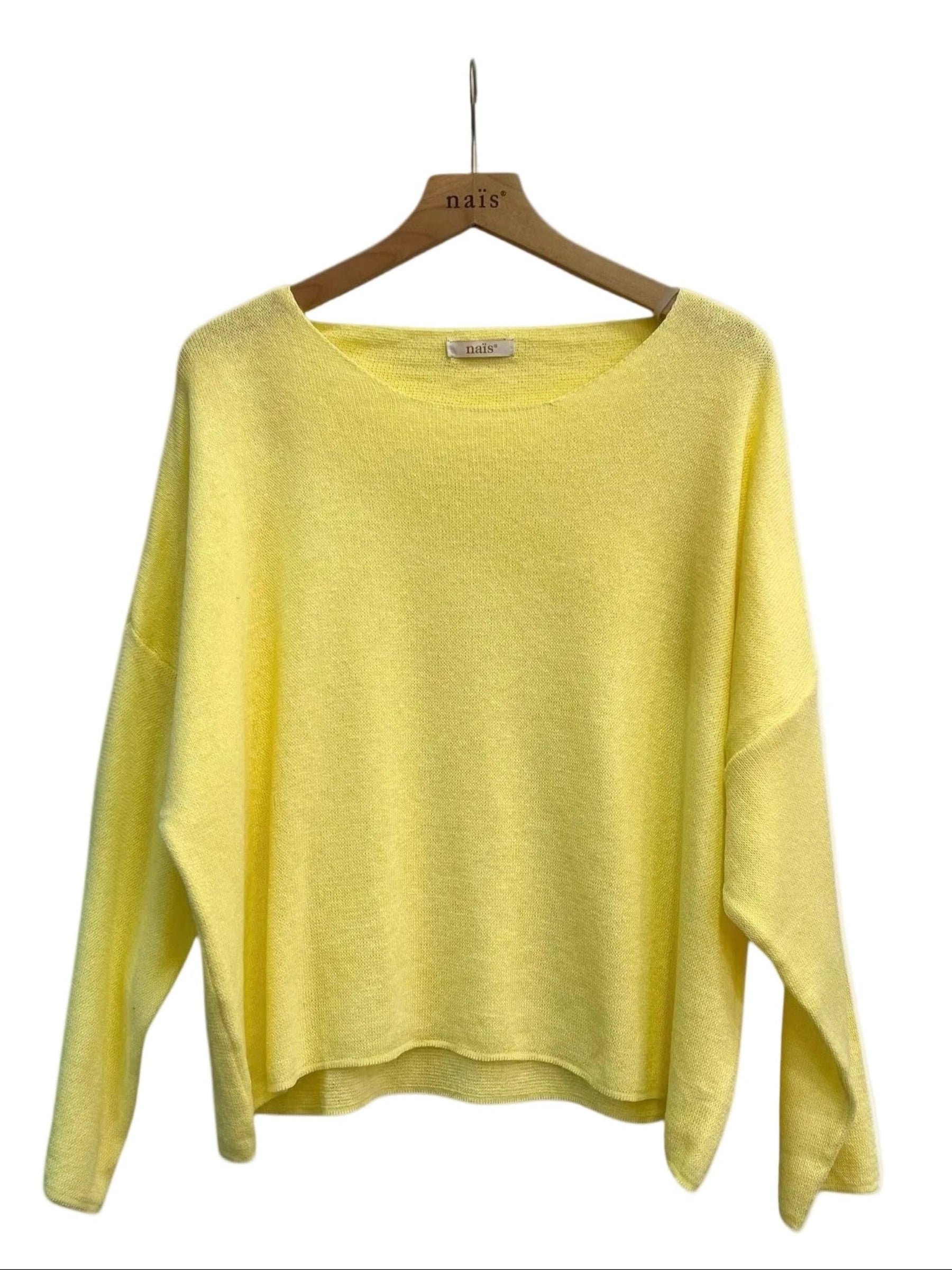 Yellow sweater on a wooden hanger against a white background
