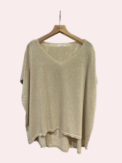 Beige sweater on a wooden hanger 
