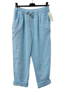 Light blue pants with a drawstring on a hanger against a white background
