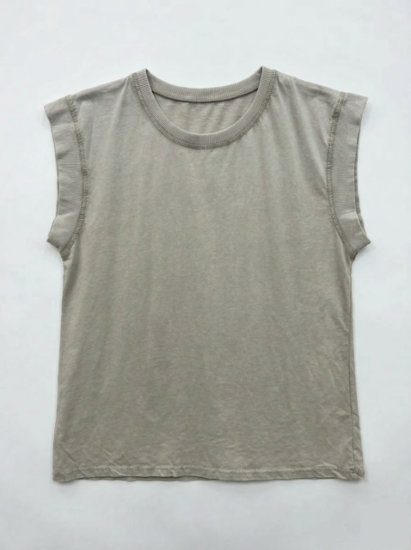 Beige sleeveless shirt on a white background