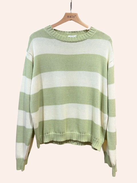 Green and white striped sweater on a hanger against a white background
