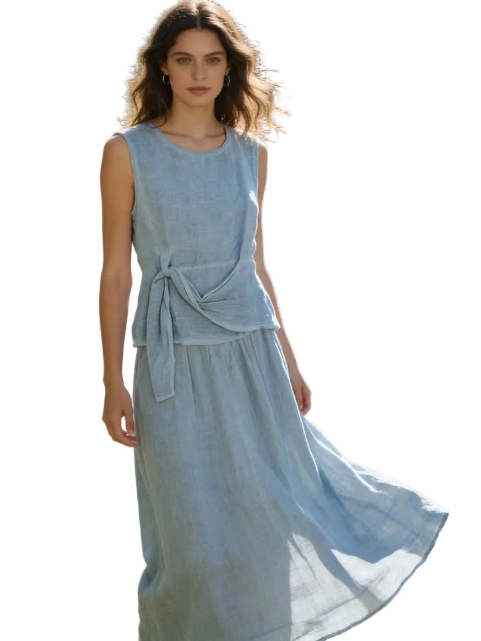 Woman in a blue jeans linen top & skirt with a white background