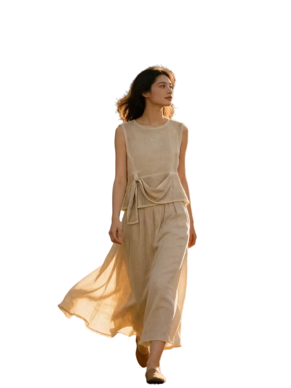 Woman in a beige top & skirt with a white background