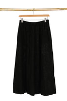 Black linen skirt with white background
