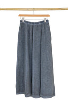 Navy blue linen skirt with white background