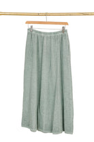 Duck green linen skirt with white background