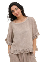 Taupe ruffled blouse on a white background