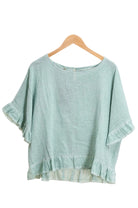 Duck Green ruffled blouse on a white background