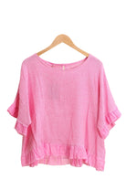 Fuchsia ruffled blouse on a white background