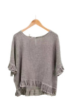Chocolate ruffled blouse on a white background