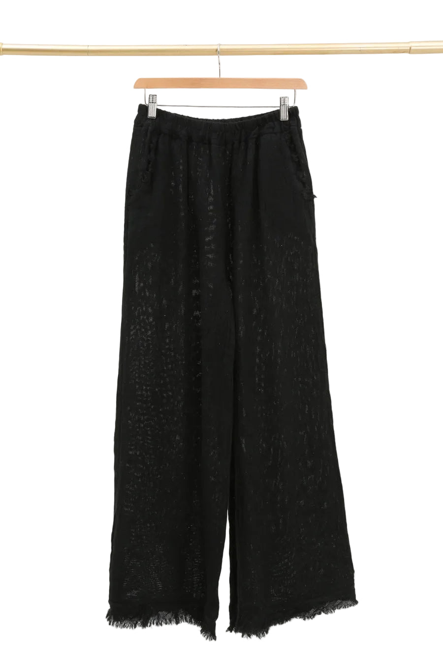 Black wide-leg pants on a hanger against a white background
