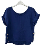 Blue textured top with button details on a white hanger