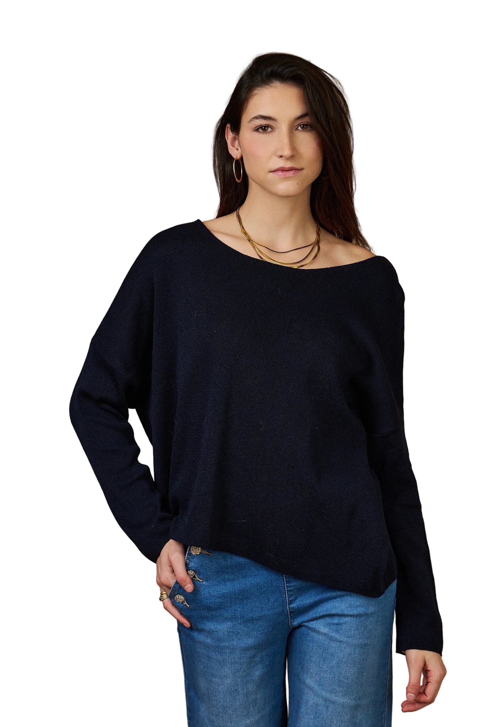 Woman wearing a navy sweater against a white background