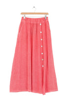 Coral skirt with button details on a white background