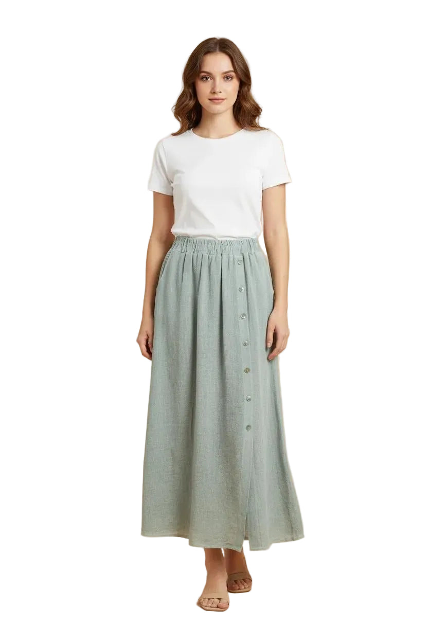 Woman wearing a white t-shirt and green button-up skirt on a white background