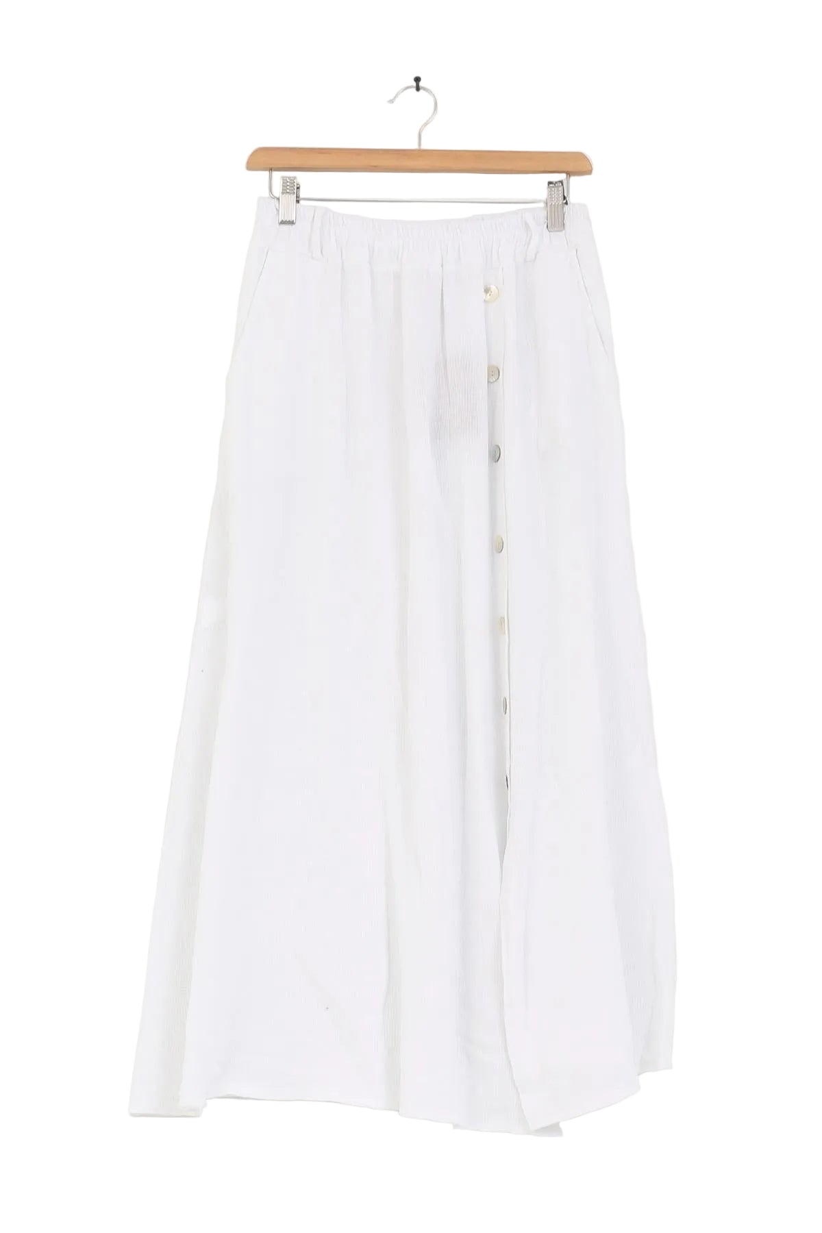 White skirt on a wooden hanger against a white background