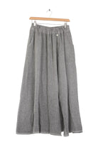 Anthracite grey skirt on a hanger against a white background