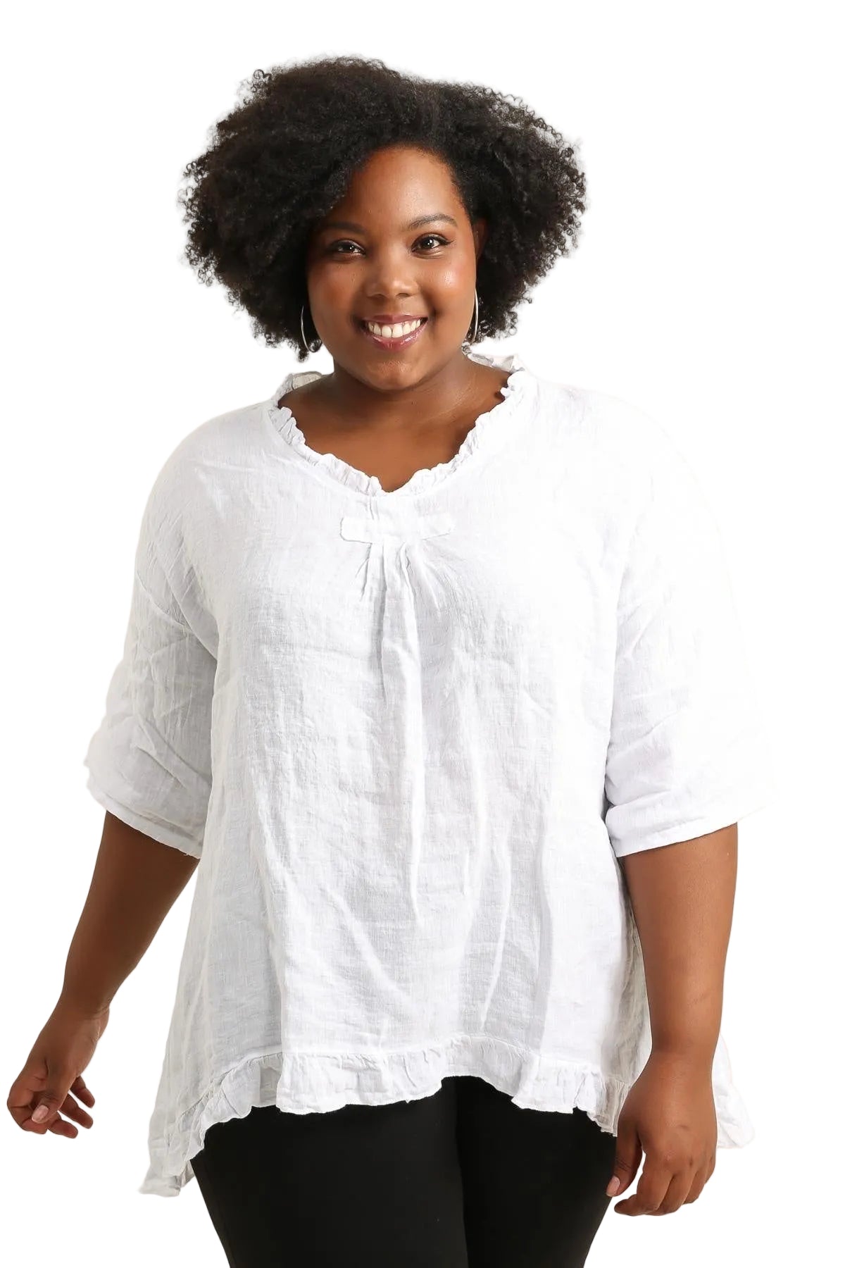 Woman wearing a white blouse with a plain background