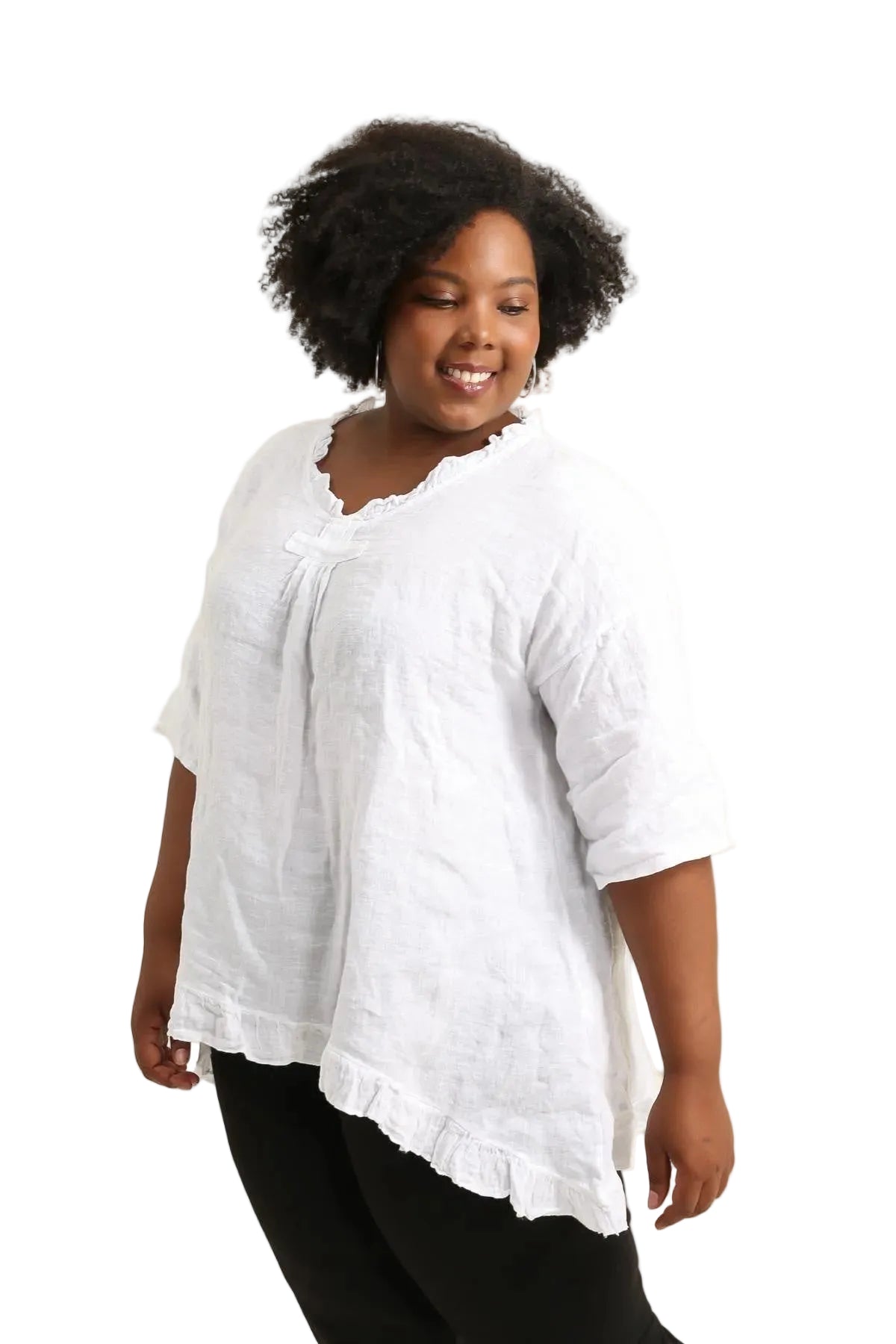 Woman wearing a white textured top and black pants on a white background