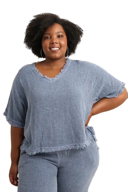 Woman wearing a blue denim outfit on a white background