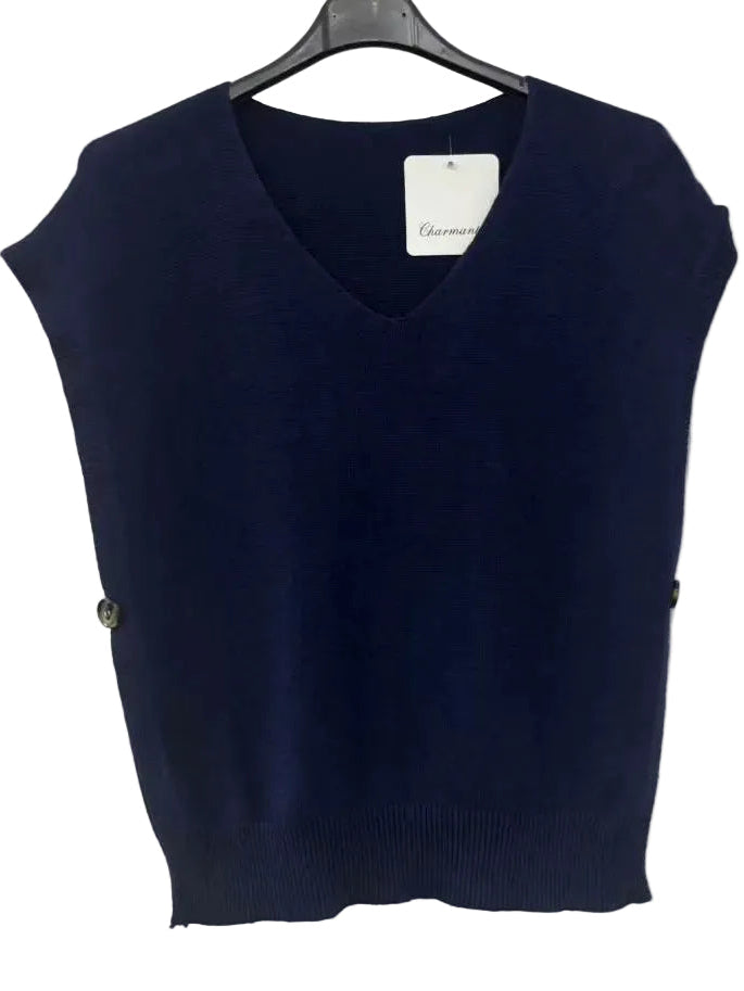 A navy blue sleeveless V-neck knit sweater vest hanging on a black hanger against a white wall. 