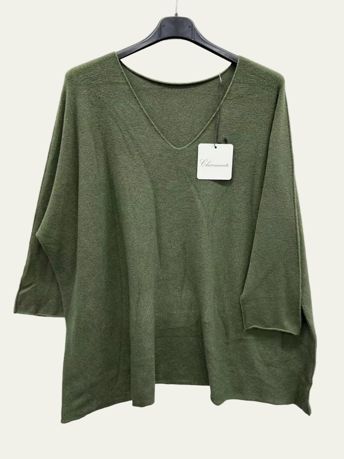 An olive green knit top with three-quarter sleeves and a V-neck,
