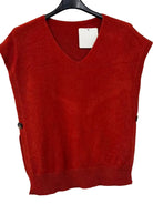 A brick coloured sleeveless V-neck knit sweater vest hanging on a black hanger against a plain white wall.
