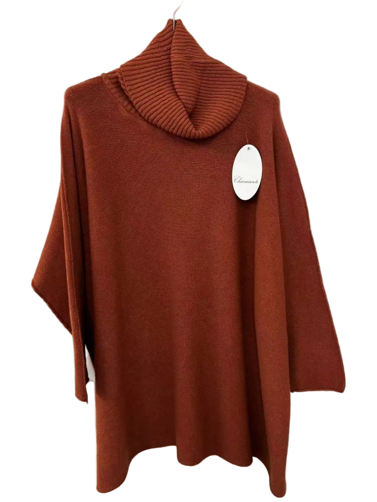A rust-orange ribbed turtleneck sweater with wide draped sleeves, hanging on a white hanger against a white wall with a white brand tag attached.