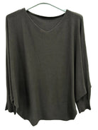 A dark brown long-sleeve V-neck knitted sweater with batwing sleeves