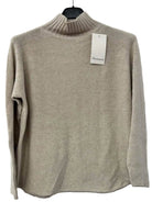 A light beige knit turtleneck sweater 