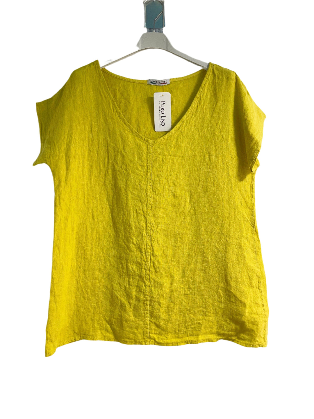 Yellow tank top on a hanger against a white background