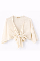 beige-colored cardigan with a knot detail on a white background