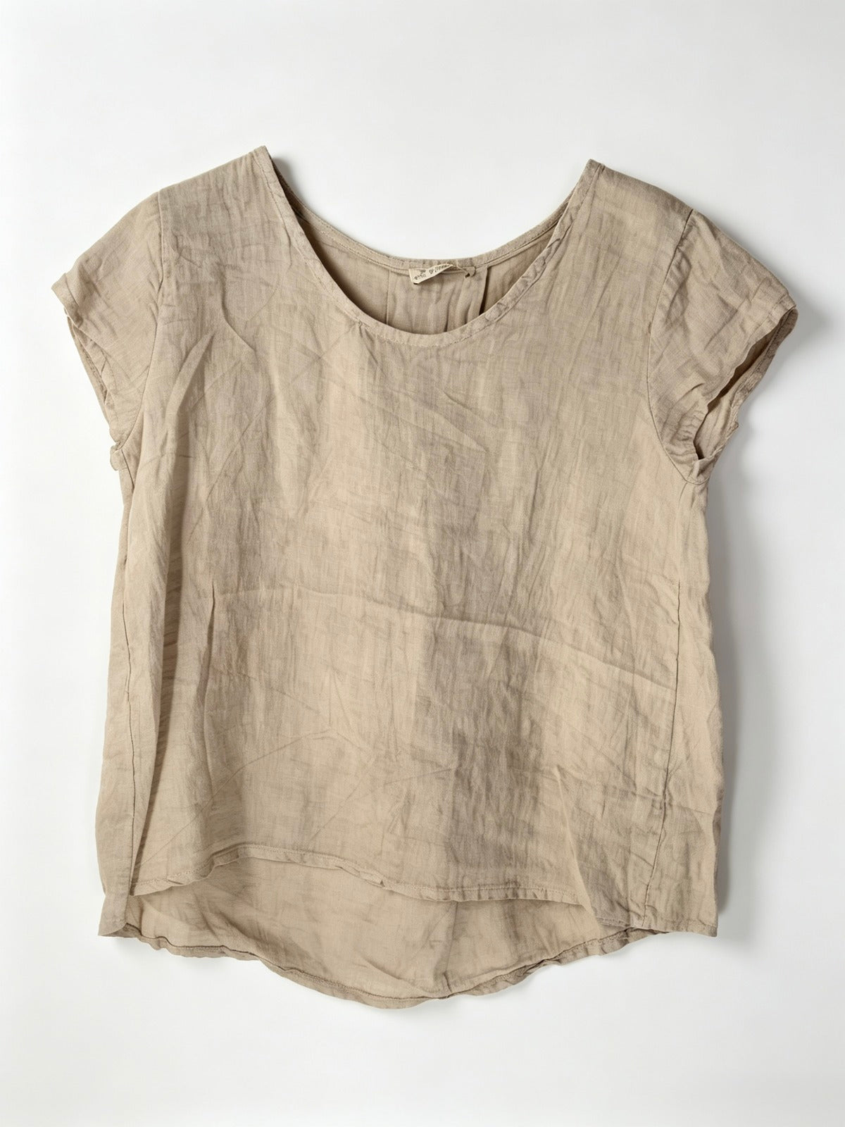 Beige linen top on a white background