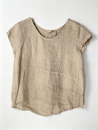 Beige linen top on a white background