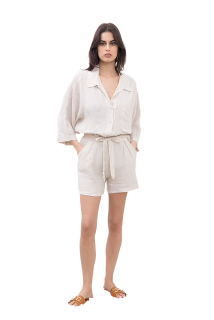 Woman wearing a beige outfit on a white background