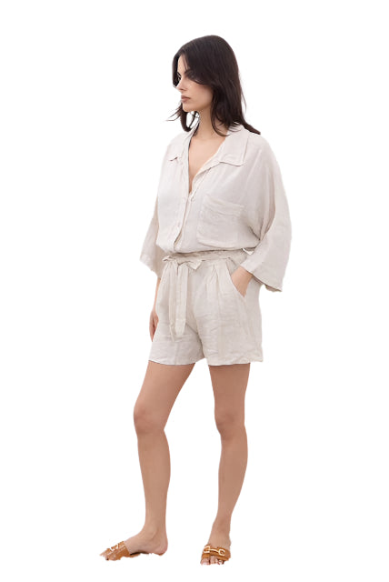 Woman wearing a beige outfit on a white background