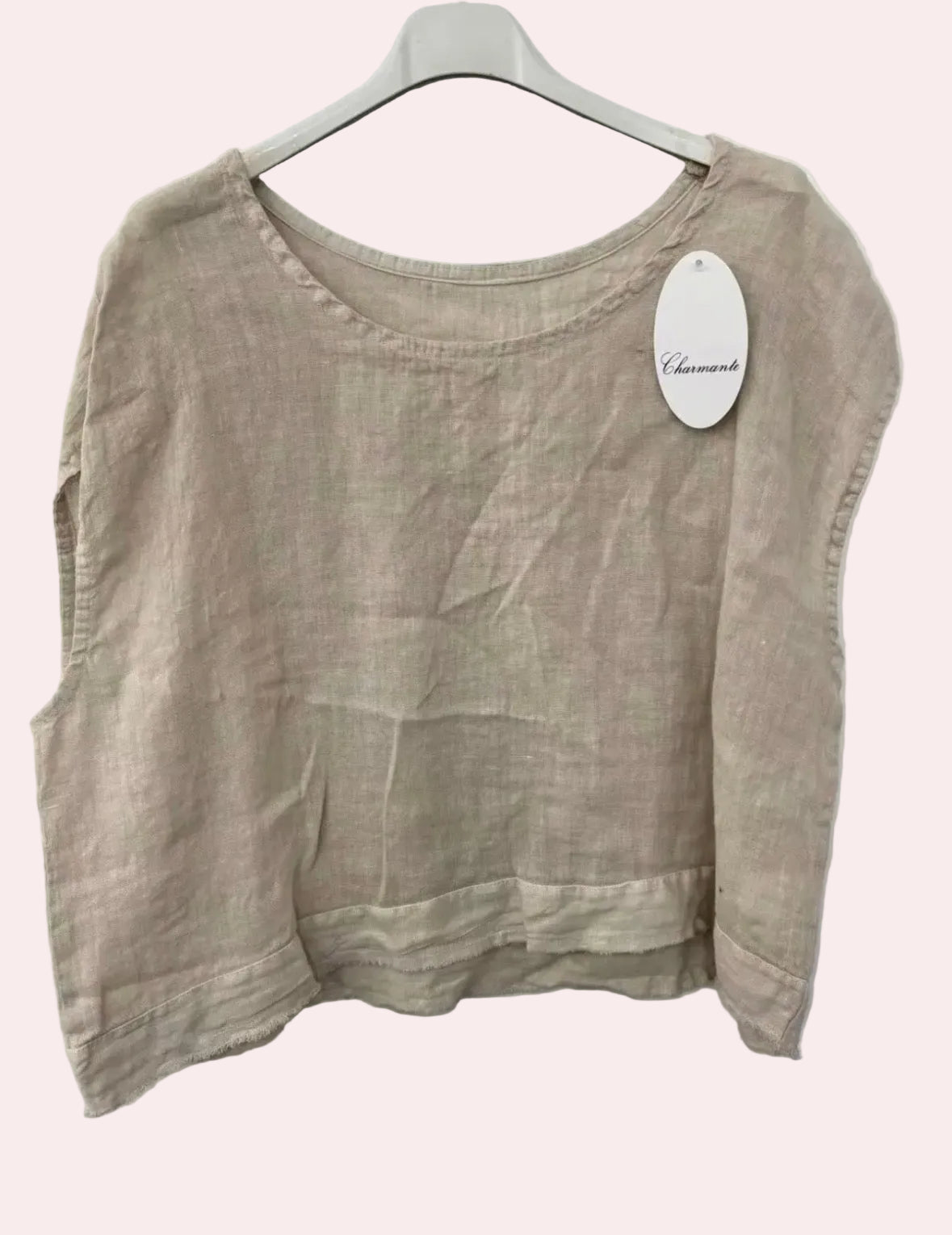 Beige linen top on a hanger 