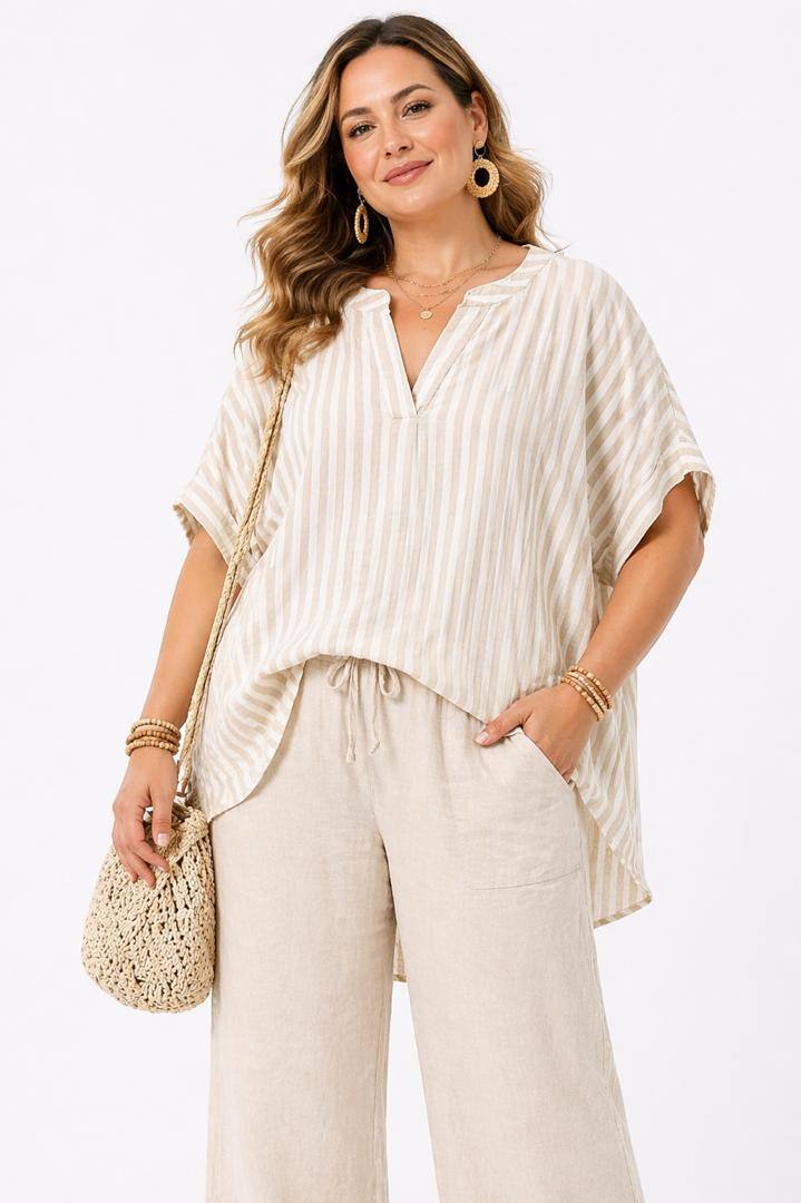 Woman wearing a beige outfit with a plain background