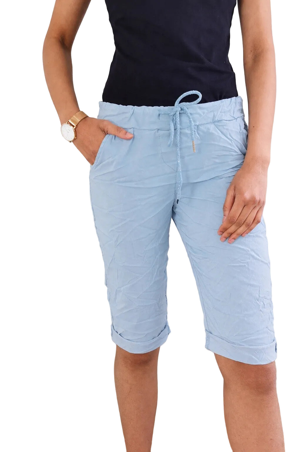 Person wearing light blue bermuda shorts