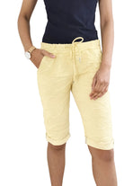 Person wearing yellow shorts 