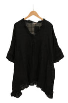 Black linen top hanger against a white background