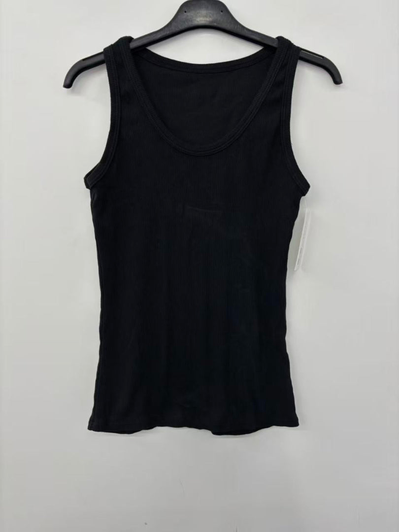 Black tank top on a hanger against a white background
